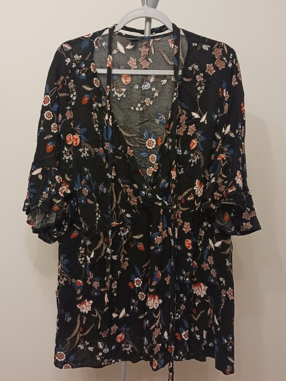 Torrid floral wrap blouse.
